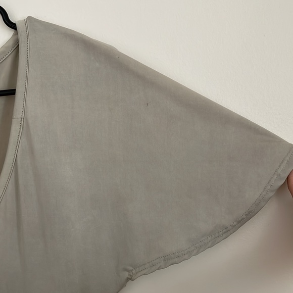 Smooth silver top with ruffle sleeves, and a plunging neckline - Picture 6 of 6